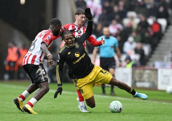 Patrick Dorgu of Manchester United, ManU is fouled by Trai Hume of Sunderland Sunderland v Manchester United, Premier League, Football, Stadium of Light, Sunderland , UK - 09 May 2026Sunderland Stadium of Light United Kingdom EDITORIAL USE ONLY No use with unauthorised audio, video, data, fixture lists, club league logos or live services. Online in-match use limited to 120 images, no video emulation. No use in betting, games or single club league player publications. Copyright: xAnnaxGowthorpe Shutterstockx 16861687x