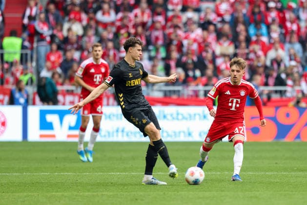 Eric Martel (1. FC Koeln, 06) mit Lennart Karl (FC Bayern Muenchen, 42), GER, FC Bayern Muenchen vs. 1. FC Koeln, Fussball, Bundesliga, 34. Spieltag, Saison 2025 2026, 16.05.2026, DFL DFB REGULATIONS PROHIBIT ANY USE OF PHOTOGRAPHS as IMAGE SEQUENCES and or QUASI-VIDEO, GER, FC Bayern Muenchen vs. 1. FC Koeln, Fussball, Bundesliga, 34. Spieltag, Saison 2025 2026, 16.05.2026 Muenchen Copyright: xEibner-Pressefoto JennixMaulx EP_JML