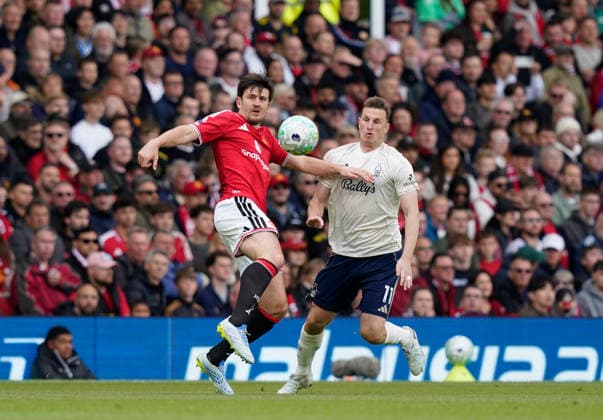 Manchester, England, 17th May 2026. Harry Maguire of Manchester United, ManU tussles with Chris Wood of Nottingham Forest during the Manchester United vs Nottingham Forest Premier League match at Old Trafford, Manchester. Picture credit should read: Andrew Yates Sportimage EDITORIAL USE ONLY. No use with unauthorised audio, video, data, fixture lists, club league logos or live services. Online in-match use limited to 120 images, no video emulation. No use in betting, games or single club league player publications. SPI_037_AY_Man_Utd_Forest SPI-4806-0036