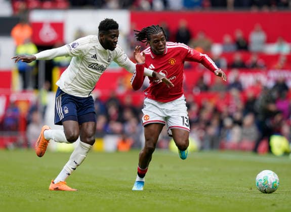Manchester, England, 17th May 2026. Ibrahim Sangare of Nottingham Forest and Patrick Dorgu of Manchester United, ManU during the Manchester United vs Nottingham Forest Premier League match at Old Trafford, Manchester. Picture credit should read: Andrew Yates Sportimage EDITORIAL USE ONLY. No use with unauthorised audio, video, data, fixture lists, club league logos or live services. Online in-match use limited to 120 images, no video emulation. No use in betting, games or single club league player publications. SPI_119_AY_Man_Utd_Forest SPI-4806-0118