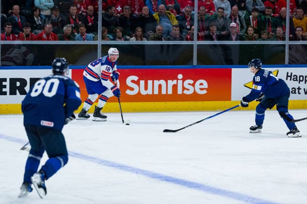 ZURICH, SWITZERLAND - MAY 18: Sam Lafferty (United States, 18) in the battle for the puck with Saku Maeenalanen (Finland, 80) and Vili Saarijaervi (Finland, 18) during the Preliminary Round - Group A Match 17 between Finland and United States at the IIHF Ice hockey, Eishockey World Championship, WM, Weltmeisterschaft 2026, Swiss Life Arena on May 18, 2026 in Zurich, Switzerland. Zurich Switzerland Copyright: xTimoxSteinx