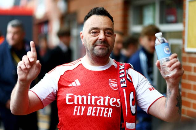 Arsenal fan with Manchester City bottle. AFC Bournemouth v Manchester City, Premier League, Football, Vitality Stadium, Bournemouth, UK - 19 May 2026Bournemouth Vitality Stadium United Kingdom EDITORIAL USE ONLY No use with unauthorised audio, video, data, fixture lists, club league logos or live services. Online in-match use limited to 120 images, no video emulation. No use in betting, games or single club league player publications. Copyright: xJamesxMarsh Shutterstockx 16881288j