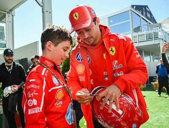 May 22, 2026, Montreal, Qc, CANADA: Ferrari driver Charles Leclerc, right, of Monaco, signs an autograph for Atticus Ianiro at the Formula One auto racing Canadian Grand Prix in Montreal on Friday, May 22, 2026. Canada News - May 22, 2026 - ZUMAc35_ 20260522_zaf_c35_024 Copyright: xGrahamxHughesx