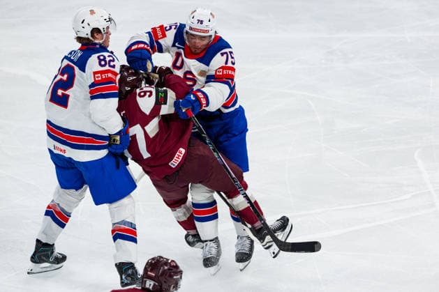 ZURICH, SWITZERLAND - MAY 23: Connor Clifton (United States, 75) and Danny Nelson (United States, 82) against Haralds Egle (Latvia, 97) during the Preliminary Round - Group A Match 37 between Latvia and United States at the IIHF Ice hockey, Eishockey World Championship, WM, Weltmeisterschaft 2026, Swiss Life Arena on May 23, 2026 in Zurich, Switzerland. Zurich Switzerland Copyright: xTimoxSteinx