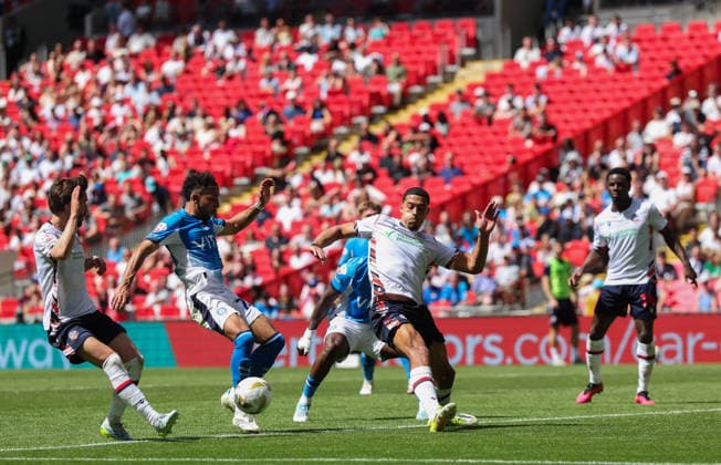 Odin Bailey of Stockport County is blocked by Chris Forino-Joseph of Bolton Wanderers Bolton Wanderers v Stockport County, EFL Sky Bet League One, Play-Off Final, Football, Wembley Stadium, London, UK - 24 May 2026London Wembley Stadium United Kingdom EDITORIAL USE ONLY No use with unauthorised audio, video, data, fixture lists, club league logos or live services. Online in-match use limited to 120 images, no video emulation. No use in betting, games or single club league player publications. Copyright: xAndrewxFosker Shutterstockx 16889807bl