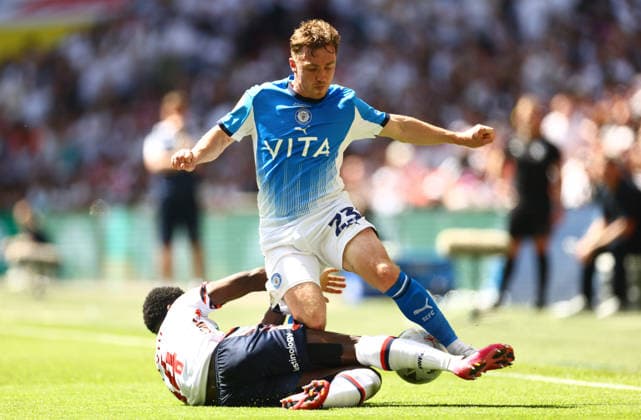 Ben Osborn of Stockport County tackled by Jordi Osei-Tutu of Bolton Wanderers Bolton Wanderers v Stockport County, EFL Sky Bet League One, Play-Off Final, Football, Wembley Stadium, London, UK - 24 May 2026London Wembley Stadium United Kingdom EDITORIAL USE ONLY No use with unauthorised audio, video, data, fixture lists, club league logos or live services. Online in-match use limited to 120 images, no video emulation. No use in betting, games or single club league player publications. Copyright: xJamesxMarsh Shutterstockx 16889809ca
