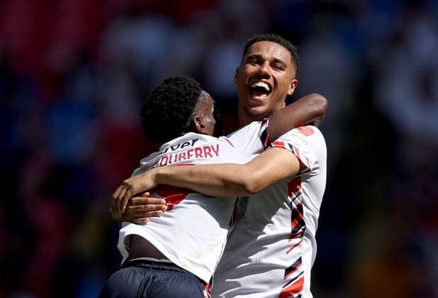 Amario Cozier-Duberry of Bolton Wanderers (left) and Ethan Erhahon of Bolton Wanderers celebrate after winning the Sky Bet EFL League One Play-off Final and promotion to the Sky Bet EFL Championship Bolton Wanderers v Stockport County, EFL Sky Bet League One, Play-Off Final, Football, Wembley Stadium, London, UK - 24 May 2026London Wembley Stadium United Kingdom EDITORIAL USE ONLY No use with unauthorised audio, video, data, fixture lists, club league logos or live services. Online in-match use limited to 120 images, no video emulation. No use in betting, games or single club league player publications. Copyright: xKieranxMcManus Shutterstockx 16889802dt