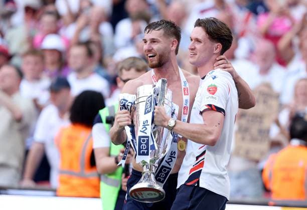 John McAtee of Bolton Wanderers (left) and Johnny Kenny of Bolton Wanderers celebrate with the trophy after winning the EFL Championship Play-off Final and promotion to the Premier League Bolton Wanderers v Stockport County, EFL Sky Bet League One, Play-Off Final, Football, Wembley Stadium, London, UK - 24 May 2026London Wembley Stadium United Kingdom EDITORIAL USE ONLY No use with unauthorised audio, video, data, fixture lists, club league logos or live services. Online in-match use limited to 120 images, no video emulation. No use in betting, games or single club league player publications. Copyright: xKieranxMcManus Shutterstockx 16889802eg