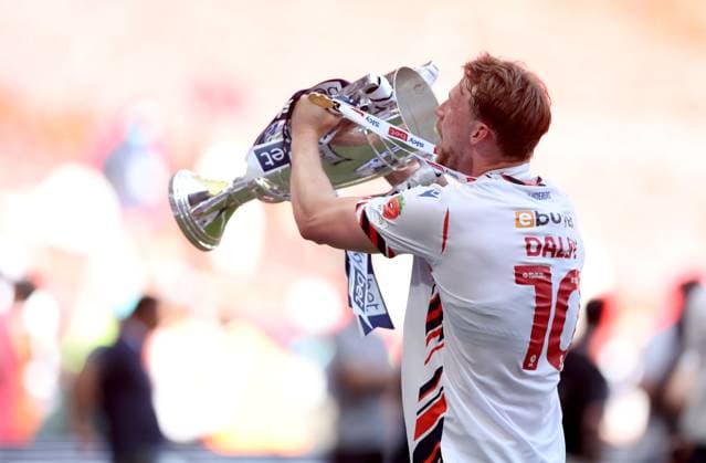 Sam Dalby of Bolton Wanderers celebrates with the trophy after winning the EFL Championship Play-off Final and promotion to the Premier League Bolton Wanderers v Stockport County, EFL Sky Bet League One, Play-Off Final, Football, Wembley Stadium, London, UK - 24 May 2026London Wembley Stadium United Kingdom EDITORIAL USE ONLY No use with unauthorised audio, video, data, fixture lists, club league logos or live services. Online in-match use limited to 120 images, no video emulation. No use in betting, games or single club league player publications. Copyright: xKieranxMcManus Shutterstockx 16889802em