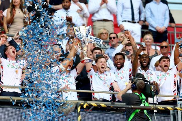 George Johnston of Bolton Wanderers celebrates with the trophy after winning the Sky Bet EFL League One Play-off Final and promotion to the Sky Bet EFL Championship Bolton Wanderers v Stockport County, EFL Sky Bet League One, Play-Off Final, Football, Wembley Stadium, London, UK - 24 May 2026London Wembley Stadium United Kingdom EDITORIAL USE ONLY No use with unauthorised audio, video, data, fixture lists, club league logos or live services. Online in-match use limited to 120 images, no video emulation. No use in betting, games or single club league player publications. Copyright: xSimonxDael Shutterstockx 16889811gi