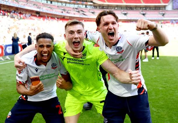 (Left to right) Ethan Erhahon, David Harrington and Johnny Kenny of Bolton Wanderers celebrate after winning the Sky Bet EFL League One Play-off Final and promotion to the Sky Bet EFL Championship Bolton Wanderers v Stockport County, EFL Sky Bet League One, Play-Off Final, Football, Wembley Stadium, London, UK - 24 May 2026London Wembley Stadium United Kingdom EDITORIAL USE ONLY No use with unauthorised audio, video, data, fixture lists, club league logos or live services. Online in-match use limited to 120 images, no video emulation. No use in betting, games or single club league player publications. Copyright: xSimonxDael Shutterstockx 16889811gz