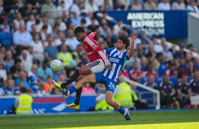 Amad Diallo of Manchester United, ManU and Ferdi Kadioglu of Brighton battle for the ball. Brighton and Hove Albion v Manchester United, Premier League, Football, American Express Community Stadium, Brighton, UK - 24 May 2026Brighton American Express Community Stadi United Kingdom EDITORIAL USE ONLY No use with unauthorised audio, video, data, fixture lists, club league logos or live services. Online in-match use limited to 120 images, no video emulation. No use in betting, games or single club league player publications. Copyright: xSeanxRyan Shutterstockx 16889822ay