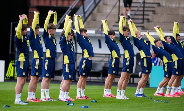 Scotland players stretch during warm up. Scotland Team Training, Football, Hampden Park, Glasgow, Scotland, UK - 29 May 2026Glasgow Hampden Park United Kingdom EDITORIAL USE ONLY No use with unauthorised audio, video, data, fixture lists, club league logos or live services. Online in-match use limited to 120 images, no video emulation. No use in betting, games or single club league player publications. Copyright: xStuartxWallace Shutterstockx 16902976aq