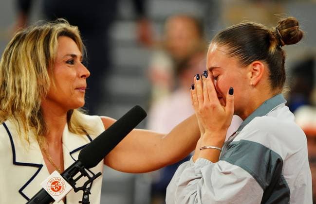 A tearful Marta Kostyuk is consoled by Marion Bartoli in her post match on court interviews French Open Tennis, Day Ten, Tennis, Roland Garros, Paris, France - 02 Jun 2026Paris Roland Garros France EDITORIAL USE ONLY No use with unauthorised audio, video, data, fixture lists, club league logos or live services. Online in-match use limited to 120 images, no video emulation. No use in betting, games or single club league player publications. Copyright: xJavierxGarcia Shutterstockx 16906549i