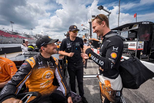 June 6, 2026, Madison, Illinois, USA: IndyCar, Indy Car, IRL, USA SERIES drivers, ROMAIN GROSJEAN (18) (CHE) of Geneva, Switzerland and DENNIS HAUGER (R) (19) (NOR) of Aurskog, Norway, talk before qualifying for the Bommarito Automotive Group 500 at World Wide Technology Raceway in MADISON Illinois. INDYCAR SERIES: June 06, 2026: Bommarito Automotive Group 500 - ZUMAa161 20260606_aaa_a161_002 Copyright: xWalterxArce GMGx