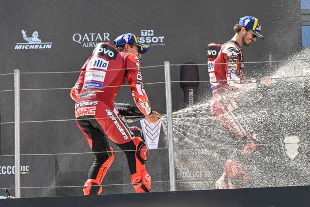 MOTO - MOTO GP - HUNGARY GRAND PRIX 2026 MARQUEZ Marc (spa), Ducati Lenovo Team, Ducati Desmosedici GP26, portrait celebrates his victory on podium with BAGNAIA Francesco (ita), Ducati Lenovo Team, Ducati Desmosedici GP26, portraitMARQUEZ Marc (spa), Ducati Lenovo Team, Ducati Desmosedici GP26, portrait celebrates his victory on podium during the 2026 MotoGP Grand Prix of Hungary , on Balaton Park circuit, from June 5 to 7, in Hungary - Balaton ParkHungary Copyright: xGIGIxSOLDANOx