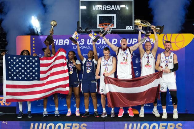 June 7, 2026, Warsaw, Masovian Voivodeship, Poland: USA s MILAYSIA FULWILEY (4), MIKAYLAH WILLIAMS (12), SAHARA WILLIAMS (6), and JOYCE EDWARDS (13) celebrate with their women s 1st place medals and the world champions trophy; Latvia s FRANCIS LACIS (6), NAURIS MIEZIS (1), KARLIS LASMANIS (2), and ZIGMARS RAIMO (9) celebrate with their men s 1st place medals and men s world champions trophy during the prize ceremony at the conclusion of the 2026 FIBA 3x3 Basketball World Cup in Warsaw, Poland. Basketball 2026: FIBA 3x3 World Cup Prize Ceremony - ZUMAk204 20260607_zip_k204_104 Copyright: xRomanxKozielx