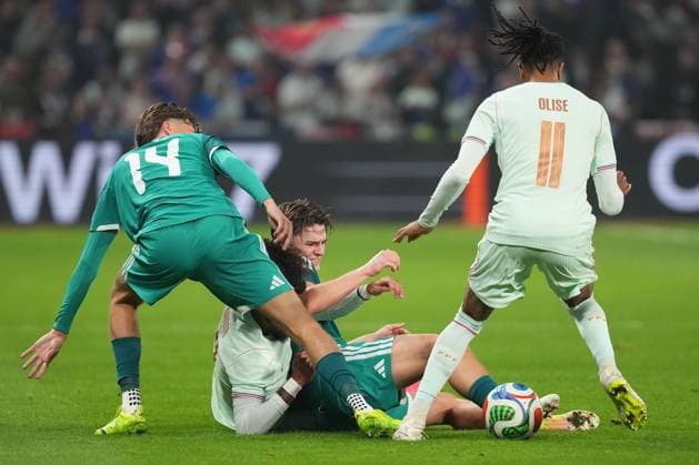 Ali McCann and Isaac Price of Northern Ireland battle it out with Malo Gusto and Michael Olise of France France v Northern Ireland, International Friendly, Länderspiel, Nationalmannschaft Football, Decathlon Arena Stade Pierre-Mauroy, Lille, France - 08 Jun 2026Lille Decathlon Arena Stade Pierre-Mau France EDITORIAL USE ONLY No use with unauthorised audio, video, data, fixture lists, club league logos or live services. Online in-match use limited to 120 images, no video emulation. No use in betting, games or single club league player publications. Copyright: xDavexWinter Shutterstockx 16912920mg