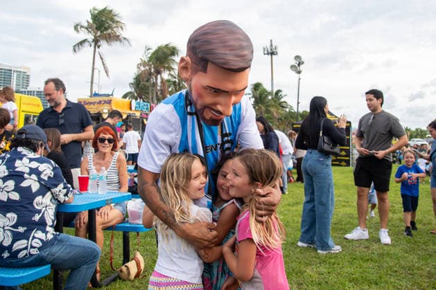 MIAMI, FL - JUNE 09: A person dressed to look like Lionel Messi wearing an Argentina national team, Nationalteam jersey interacts with event attendees on June 9, 2026 at Haulover Park, in Miami, FL. The Food Trucks Tuesdays event at Haulover Park is a weekly free admission community event featuring local food vendors, family-friendly activities, music, and kite flying. Recent events include Panini FIFA World Cup, WM, Weltmeisterschaft, Fussball 2026 Sticker trading, with a goal of helping collectors fill their albums. The performer dressed like Lionel Messi was introduced to attendees as a surprise guest visiting ahead of the 2026 FIFA World Cup. (Photo by Erica Denhoff Icon Sportswire) SOCCER: JUN 09 Food Trucks Tuesdays at Haulover Park EDITORIAL USE ONLY Icon260902