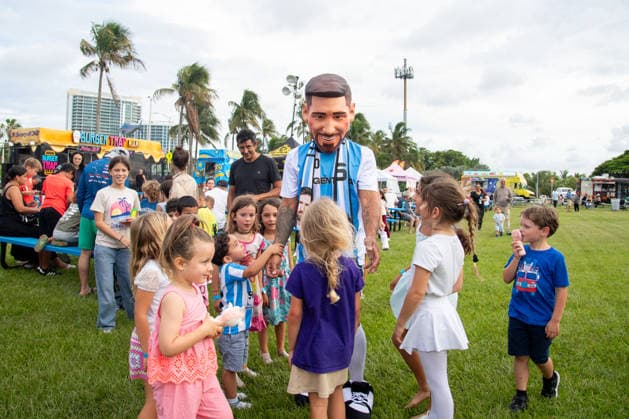 MIAMI, FL - JUNE 09: A person dressed to look like Lionel Messi wearing an Argentina national team, Nationalteam jersey interacts with event attendees on June 9, 2026 at Haulover Park, in Miami, FL. The Food Trucks Tuesdays event at Haulover Park is a weekly free admission community event featuring local food vendors, family-friendly activities, music, and kite flying. Recent events include Panini FIFA World Cup, WM, Weltmeisterschaft, Fussball 2026 Sticker trading, with a goal of helping collectors fill their albums. The performer dressed like Lionel Messi was introduced to attendees as a surprise guest visiting ahead of the 2026 FIFA World Cup. (Photo by Erica Denhoff Icon Sportswire) SOCCER: JUN 09 Food Trucks Tuesdays at Haulover Park EDITORIAL USE ONLY Icon260909
