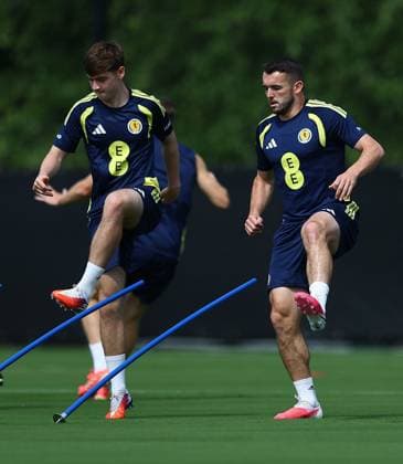 Findlay Curtis and John McGinn of Scotland Scotland Training Session and press conference, PK, Pressekonferenz 2026 FIFA World Cup, WM, Weltmeisterschaft, Fussball Football, Atrium Health Performance Park, Charlotte, USA - 10 Jun 2026Charlotte Atrium Health Performance Park United States of America EDITORIAL USE ONLY No use with unauthorised audio, video, data, fixture lists, club league logos or live services. Online in-match use limited to 120 images, no video emulation. No use in betting, games or single club league player publications. Copyright: xMichaelxZemanek Shutterstockx 16919987be