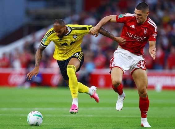 Lukas Nmecha of Leeds United and Nikola Milenkovic of Nottingham Forest Nottingham Forest v Leeds United, EFL Carabao Cup, Second Round, Football, City Ground, Nottingham, UK - 25 Aug 2026Nottingham City Ground United Kingdom EDITORIAL USE ONLY No use with unauthorised audio, video, data, fixture lists, club league logos or live services. Online in-match use limited to 120 images, no video emulation. No use in betting, games or single club league player publications. Copyright: xMattxWest Shutterstockx 17115032aa