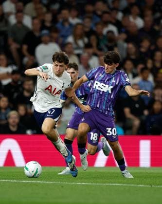 Mikey Moore of Tottenham Hotspur takes on Rob Apter of Charlton Athletic Tottenham Hotspur v Charlton Athletic, EFL Carabao Cup, Second Round, Football, Tottenham Hotspur Stadium, London, UK - 26 Aug 2026London Tottenham Hotspur Stadium United Kingdom EDITORIAL USE ONLY No use with unauthorised audio, video, data, fixture lists, club league logos or live services. Online in-match use limited to 120 images, no video emulation. No use in betting, games or single club league player publications. Copyright: xMattxImpey Shutterstockx 17115050aq