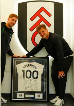 Emile Smith Rowe of Fulham photobombs Joachim Andersen as he poses with a signed and framed shirt to mark his 100th appearance for the club Fulham v AFC Wimbledon, EFL Carabao Cup, Second Round, Football, Craven Cottage, London, UK - 27 Aug 2026London Craven Cottage United Kingdom EDITORIAL USE ONLY No use with unauthorised audio, video, data, fixture lists, club league logos or live services. Online in-match use limited to 120 images, no video emulation. No use in betting, games or single club league player publications. Copyright: xJavierxGarcia Shutterstockx 17118946cv