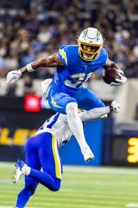 August 27, 2026, Inglewood, California, USA: Los Angeles Chargers Running Back Gregory Desrosiers (31) leaps over Los Angeles Rams Cornerback Cam Lampkin (21) during an NFL, American Football Herren, USA football preseason game, in Inglewood, Calif. on Thursday August 27, 2026. NHL, Eishockey Herren, USA 2026: LA Rams 20:18 LA Chargers - ZUMAc68_ 20260827_zaf_c68_011 Copyright: xRingoxChiux