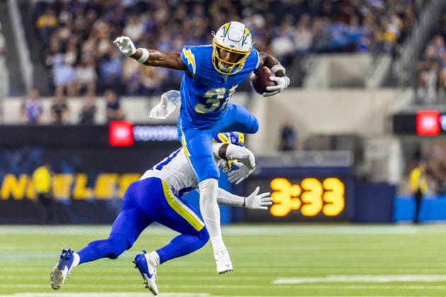 August 27, 2026, Inglewood, California, USA: Los Angeles Chargers Running Back Gregory Desrosiers (31) leaps over Los Angeles Rams Cornerback Cam Lampkin (21) during an NFL, American Football Herren, USA football preseason game, in Inglewood, Calif. on Thursday August 27, 2026. NHL, Eishockey Herren, USA 2026: LA Rams 20:18 LA Chargers - ZUMAc68_ 20260827_zaf_c68_012 Copyright: xRingoxChiux