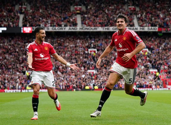 Manchester, England, 30th August 2026. Harry Maguire of Manchester United, ManU celebrates after his deflected shot went in for their second goal during the Manchester United vs Ipswich Town Premier League match at Old Trafford, Manchester. Picture credit should read: Andrew Yates Sportimage EDITORIAL USE ONLY. No use with unauthorised audio, video, data, fixture lists, club league logos or live services. Online in-match use limited to 120 images, no video emulation. No use in betting, games or single club league player publications. SPI_058_AY_Man_Utd_Ipswich SPI-4945-0058