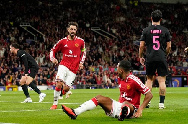 Manchester, England, 10th September 2026. Second goal scorer Bruno Fernandes of Manchester United, ManU celebrates with Youri Tielemans of Manchester United during the Manchester United vs Sabah UEFA Champions League match at Old Trafford, Manchester. Picture credit should read: Andrew Yates Sportimage EDITORIAL USE ONLY. No use with unauthorised audio, video, data, fixture lists, club league logos or live services. Online in-match use limited to 120 images, no video emulation. No use in betting, games or single club league player publications. SPI_032_AY_Man_Utd_Sabah SPI-4989-0032