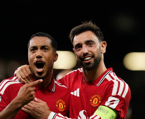 Manchester, England, 10th September 2026. Second goal scorer Bruno Fernandes of Manchester United, ManU (r) celebrates with Youri Tielemans of Manchester United (l) during the Manchester United vs Sabah UEFA Champions League match at Old Trafford, Manchester. Picture credit should read: Andrew Yates Sportimage EDITORIAL USE ONLY. No use with unauthorised audio, video, data, fixture lists, club league logos or live services. Online in-match use limited to 120 images, no video emulation. No use in betting, games or single club league player publications. SPI_035_AY_Man_Utd_Sabah SPI-4989-0035