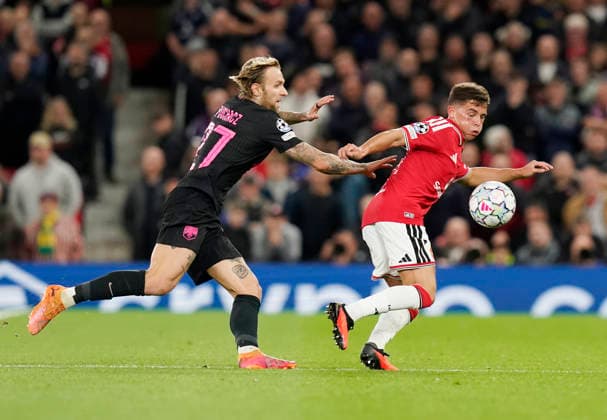 Manchester, England, 10th September 2026. Tymoteusz Puchacz of Sabah FC tussles with Shea Lacey of Manchester United, ManU during the Manchester United vs Sabah UEFA Champions League match at Old Trafford, Manchester. Picture credit should read: Andrew Yates Sportimage EDITORIAL USE ONLY. No use with unauthorised audio, video, data, fixture lists, club league logos or live services. Online in-match use limited to 120 images, no video emulation. No use in betting, games or single club league player publications. SPI_059_AY_Man_Utd_Sabah SPI-4989-0059