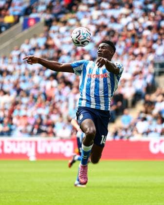 Taiwo Awoniyi of Coventry City in action Coventry City v Brighton and Hove Albion, Premier League, Football, Football, Coventry Building Society Arena, Coventry, UK - 13 Sep 2026Coventry Coventry Building Society Arena United Kingdom EDITORIAL USE ONLY No use with unauthorised audio, video, data, fixture lists, club league logos or live services. Online in-match use limited to 120 images, no video emulation. No use in betting, games or single club league player publications. Copyright: xJamesxMarsh Shutterstockx 17144596ea