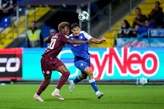 v.li.: Romeo Aigbekaen (Köln, 30), Sean Dulic (TSG II, 3), Zweikampf, Spielszene, Duell, duel, tackle, tackling, Dynamik, Action, Aktion, 13.09.2026, Sinsheim (Deutschland), Fussball, 3. Liga, TSG 1899 Hoffenheim II - SC Fortuna Köln, DFB DFL REGULATIONS PROHIBIT ANY USE OF PHOTOGRAPHS AS IMAGE SEQUENCES AND OR QUASI-VIDEO.