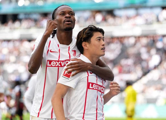 Jordy Makengo (SC Freiburg, 33) and Yuito Suzuki (SC Freiburg, 14) celebrate after a goal GER, Eintracht Frankfurt vs SC Freiburg, 1. Bundesliga, 4. Spieltag, Saison 2026-27, Deutsche Bank Park, Frankfurt, 19.09.2026 DFL REGULATIONS PROHIBIT ANY USE OF PHOTOGRAPHS AS IMAGE SEQUENCES AND OR QUASI-VIDEO Eintracht Frankfurt vs SC Freiburg, 1. Bundesliga, 4. Spieltag, Saison 2026-27, 19.09.2026 Frankfurt am Main Copyright: xEibner-Pressefoto ScottxColemanx EP_SCN
