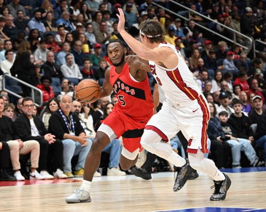 October 3, 2026, Quebec, On, Canada: Toronto Raptors Immanuel Quickley drives as Miami Heat s Pelle Larsson defends during NBA, Basketball Herren, USA preseason basketball action in Quebec City, Saturday, Oct. 3, 2026. Canada News - October 3, 2026 - ZUMAc35_ 20261003_zaf_c35_126 Copyright: xJacquesxBoissinotx