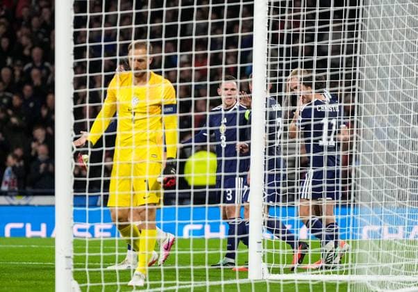 Ryan Christie of Scotland celebrates with team mates after scoring to give Scotland a 1-0 lead, with Slovenia goalkeeper Jan Oblak in foreground. Scotland v Slovenia, Football, UEFA Nation s League, Group B1, Hampden Park, Glasgow, UK, Hampden Park, Glasgow, Scotland, Scotland, UK - 06 Oct 2026Glasgow Hampden Park Scotland United Kingdom Copyright: xStuartxWallace Shutterstockx 17189021h