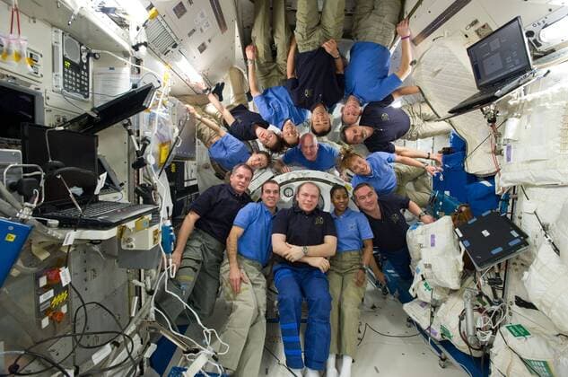 This April 14, 2010 NASA image shows a group photo of the STS-131 and Expedition 23 crew members in the Kibo laboratory of the International Space Station while space shuttle Discovery remains docked with the station. STS-131 crew members pictured (light blue shirts) are NASA astronauts Alan Poindexter, commander; James P. Dutton Jr., pilot; Clayton Anderson, Rick Mastracchio, Dorothy Metcalf-Lindenburger, Stephanie Wilson and Japan Aerospace Exploration Agency astronaut Naoko Yamazaki, all mission specialists. Expedition 23 crew members pictured are Russian cosmonauts Oleg Kotov, commander; Mikhail Kornienko and Alexander Skvortsov; Japan Aerospace Exploration Agency astronaut Soichi Noguchi, and NASA astronauts T.J. Creamer and Tracy Caldwell Dyson, all flight engineers. WAX20100418302