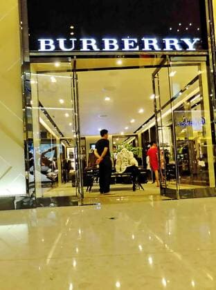 --File--View of a Burberry boutique in Shanghai, China, 30 July 2011. Burberry has been awarded ¡ê63 million ($100 million) in damages after taking a network of Chinese counterfeiters to court. WWD report that the defendants, who ran websites such as yesburberryvision.com and buyburberry.com, were known to have sold at least 22 different product types all bearing imitations of the British heritage brands various trademarks, such as its iconic plaid check and equestrian knight logo. The resolution of the case, which was originally filed in January at Manhattan Federal Court, comes after months of waiting for the defendants to reply to the accusations and appear in court - neither of which was ever done. The domain names for all the infringing sites will now be transferred to Burberry, allowing the brand to cut off any associated internet providers, web designers, sponsored search engin pau635498_01