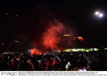 Feb. 1, 2016 - Cairo, Cairo, Egypt - Al Ahly fans, also known as Ultras , light flares and shout slogans at al-Ahly club s training stadium marking the fourt anniversary of killing al-Ahly fans in what known as the Port Said massacre , on February 1, 2016. On 1 February 2012, a massive riot occurred at Port Said Stadium in Port Said city, Egypt, following an Egyptian Premier League football match between El Masry and El Ahly clubs. At least 74 people were killed and more than 500 were injured after thousands of El Masry spectators stormed the stadium stands and the pitch Cairo Egypt - ZUMAap3_