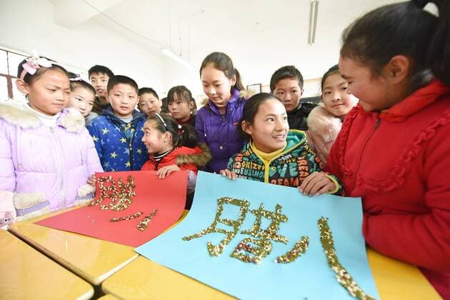 January 4, 2017 - Lianyungang, Lianyungang, China - Lianyungang, CHINA-January 4 2017: (EDITORIAL USE ONLY. CHINA OUT)..Pupils learn to recognize five kinds of cereals under the guidance of teacher at a primary school in Donghai County, Lianyungang City,east China s Jiangsu Province, January 4th, 2017, celebrating the Laba Rice Porridge Festival which falls on January 5th this year. The Laba Rice Porridge Festival is a traditional Chinese festival falls on the 8th day of the 12th month of lunar calendar. It s customary on this day to drink the special porridge, usually stewed of at least eight ingredients. With rice as the main ingredient, this porridge may well contain ingredients like broad beans, red beans, mung beans, red dates, peanuts, chest nuts, both tasty and nutritious. Lianyungang China - ZUMAs145 20170104_zaa_s145_205