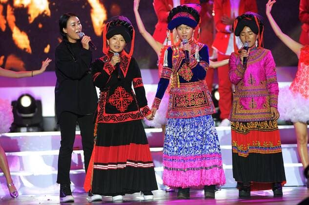SANYA, Jan. 5, 2017 -- Pop singer Na Ying (1st L) sings with three girls who were once the students of Asur, a winner of the Jack Ma Rural Teachers Award, during the awarding ceremony in Sanya, a tourism resort in south China s Hainan Province, on Jan. 5, 2017. The awarding ceremony of the Jack Ma Rural Teachers Award was held on Thursday, with 100 rural teachers winning the award of 100,000 yuan (14,522 U.S. dollars) respectively. ) (wf) CHINA-SANYA-JACK MA-RURAL TEACHERS AWARD (CN) YangxGuanyu