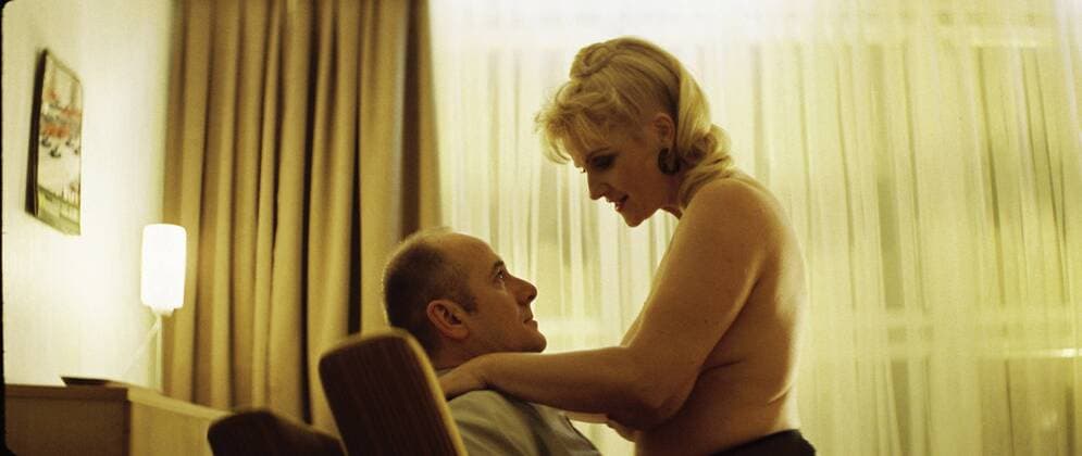 RELEASE DATE: February 9, 2007. MOVIE TITLE: Das Leben der Anderen (North America: The Lives of Others ) - STUDIO: Creado Film Sony Pictures Classics. PLOT: Captain Wiesler (Muhe) is a wiretapping expert with the Stasi (East German Secret Police) in the mid-eighties,who becomes disillusioned with his career and life in general in the former socialist republic when his latest assignment, Georg Dreyman (Koch), a playwright with views against the totalitarian state, starts to challenge his beliefs through his overheard conversations. PICTURED: ULRICH MUHE as Hauptmann Gerd Wiesler and a prostitute. - ZUMAg90_ 20070209_ddn_g90_500