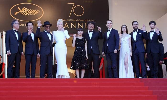 (From L to R) Byung Heebong, Giancarlo Esposito, Steven Yeun, Tilda Swinton, Ahn Seo-Hyun, Bong Joon-Ho, Paul Dano, Lily Collins, Jake Gyllenhaal and Devon Bostic arrive on the red carpet before the screening of the film Okja during the 70th annual Cannes International Film Festival in Cannes, France on May 19, 2017. CAN20170519110 DAVIDxSILPA