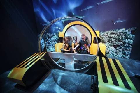 (180315) -- NEW YORK, March 15, 2018 -- Children play in a model undersea submersible at the Unseen Oceans exhibition held in the American Museum of Natural History in New York, the United States, March 14, 2018. The exhibition highlights the latest advances in ocean exploration, the researchers and technologies behind them and the mysteries that remain. Visitors can join scientists on their high-tech, high-adventure, and high-impact fieldwork to see and discover beautiful, diverse, and important creatures living at previously unseen ocean layers. ) (djj) U.S.-NEW YORK-UNSEEN OCEANS-EXHIBITION WangxYing