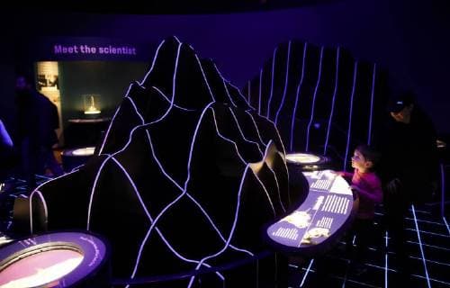 (180315) -- NEW YORK, March 15, 2018 -- A child learns about undersea landscape at the Unseen Oceans exhibition held in the American Museum of Natural History in New York, the United States, March 14, 2018. The exhibition highlights the latest advances in ocean exploration, the researchers and technologies behind them and the mysteries that remain. Visitors can join scientists on their high-tech, high-adventure, and high-impact fieldwork to see and discover beautiful, diverse, and important creatures living at previously unseen ocean layers. ) (djj) U.S.-NEW YORK-UNSEEN OCEANS-EXHIBITION WangxYing