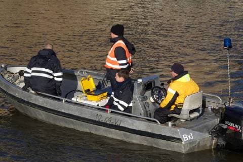 - BRUGGE, BELGIUM: Illustration picture shows divers and police during the search for Frederic Coopman, Tuesday 13 December 2011 in the Ringvaart river in Brugge. 20 year old student Coopman has been missing since he left a party on Saturday, his gray woolen hat and one of his black gloves were found at the Gentpoort in Brugge. KURTxDESPLENTER x31604418x
