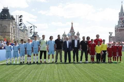 MOSCOW, RUSSIA - JUNE 28, 2018: Spanish football player Iker Casillas (6th L), 2018 FIFA World Cup Ambassador Alexei Smertin (7th L), Brazilian football player Ronaldo Luiz (8th L), Russia s President Vladimir Putin (9th L), FIFA President Gianni Infantino (10th L), German football player Lothar Matthaus (11th L), Spanish football player Carles Puyol (2nd R back), and Russian football player Dmitry Bulykin (R back), and young football players visit the 2018 FIFA World Cup Football Park in Red Square. Mikhail Metzel TASS TS086D71